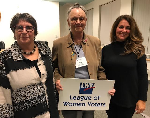 Brookline League President Betsy Dewitt is flanked by the two speakers at Opening Meeting. To her right is Tina Cassidy, author of "Mr. President, How Long Must We Wait?" who spoke about her book on women getting the right to vote. On her left is local hi