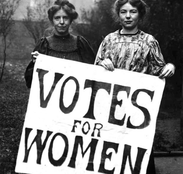 Suffragettes with Votes for Women sign