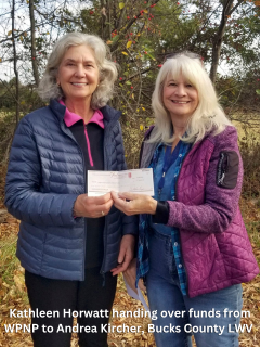photo of 2 older white women caption kathleen horwatt handing over funds from wpnp to andrea kircher bucks county lwv