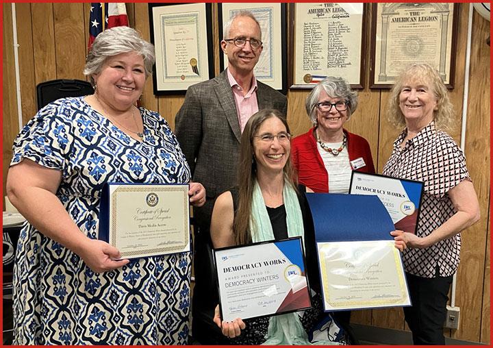 Five people holding their 2024 Democracy Works Award Certifications