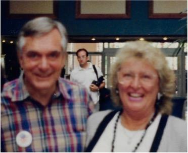 Gentleman in plaid shirt on left and woman in white shirt on left