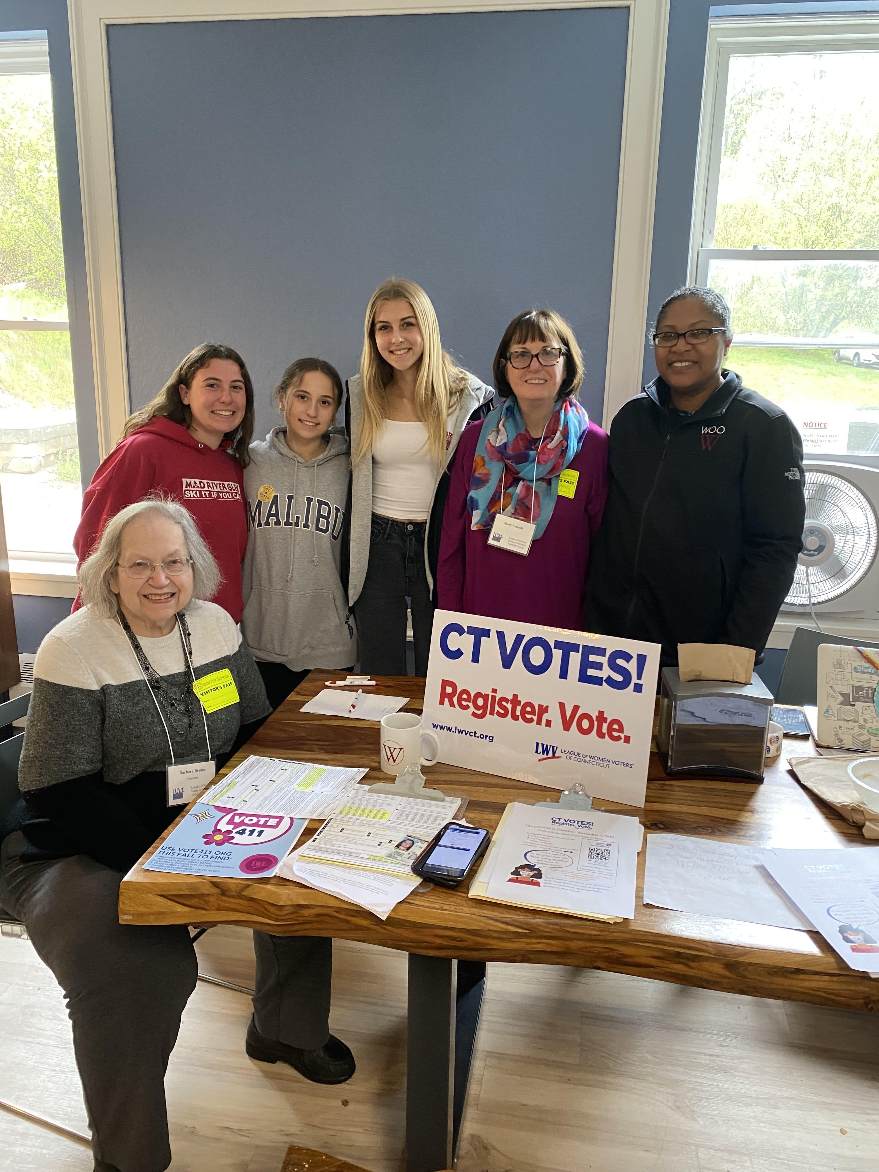 3 members of LWVNFC registering 3 students from Wooster School to vote.