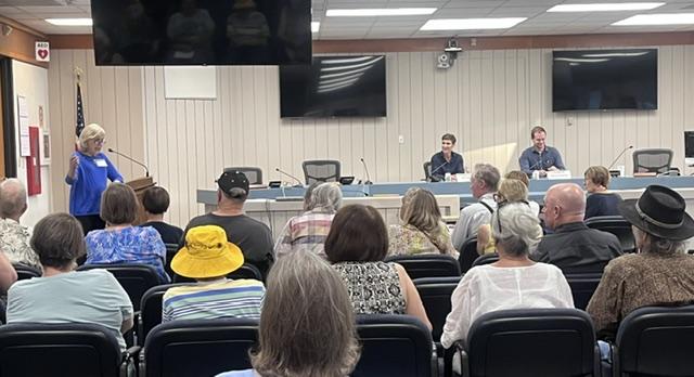 Jane Braga going over the Candidate Forum Rules.
