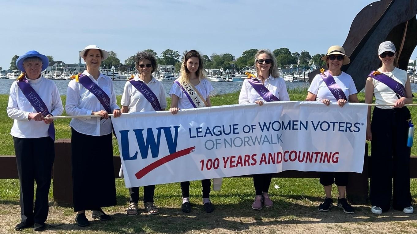 LWV members with "100 Years and Counting" banner at Norwalk's Memorial Day Parade, Monday 5/29/23
