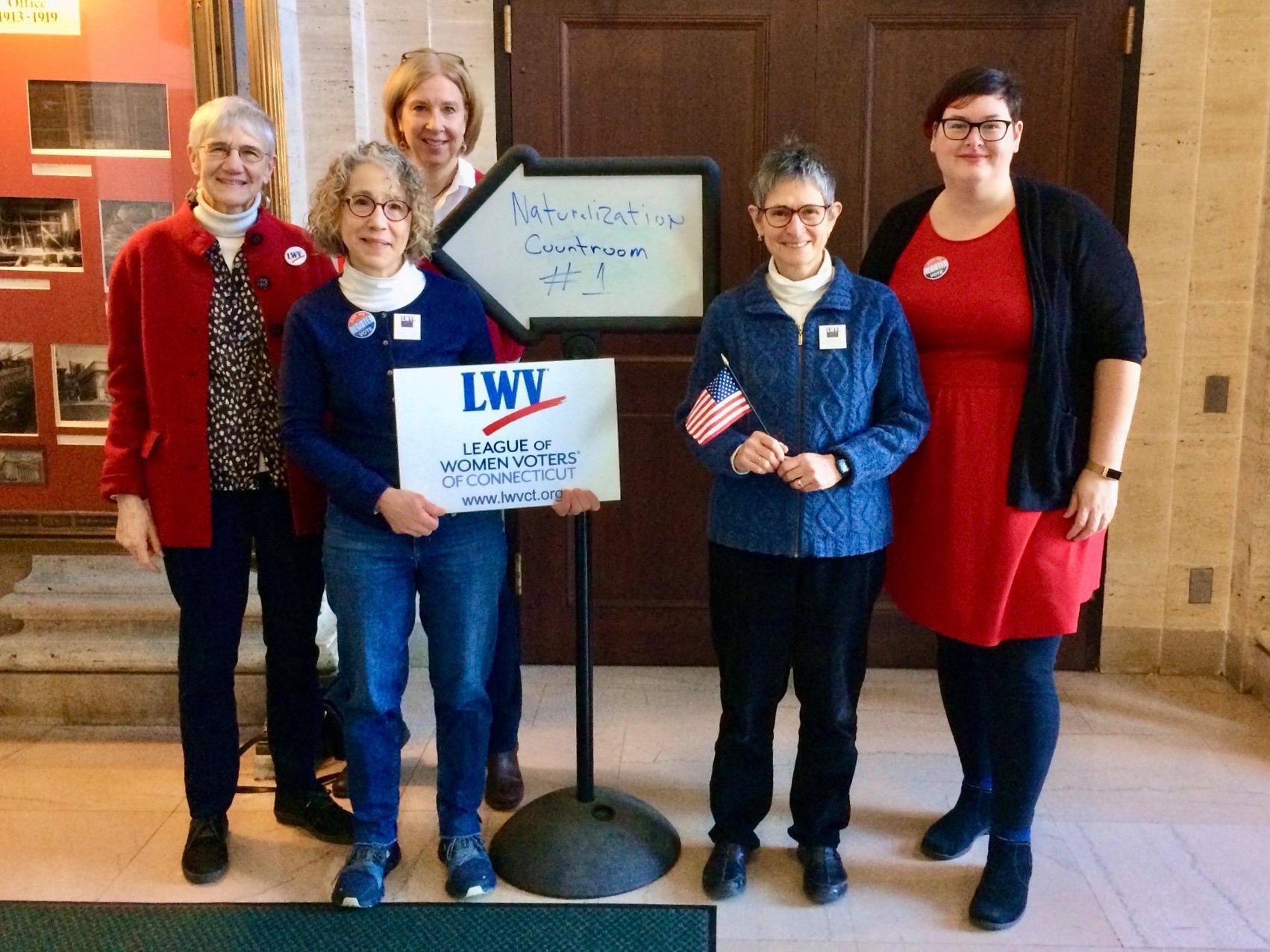 Members of the League of Women Voters of New Haven posing in the lobby of the New Haven Court House