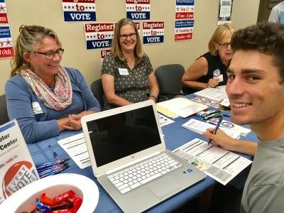 National Voter Registration Day photo - League members sit with registering voter