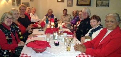 League members sit around the dinner table at Christmas party