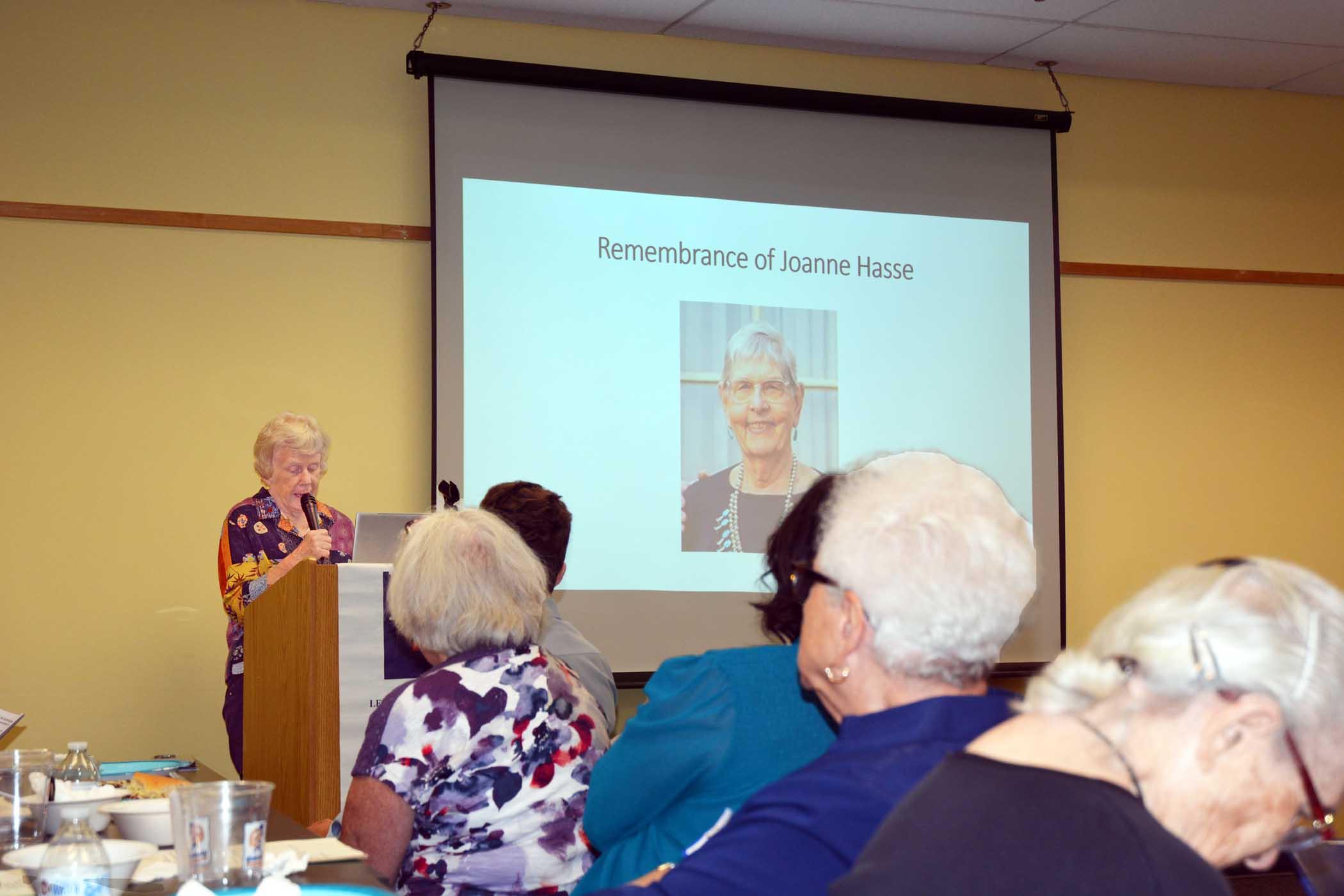 Marj Johnson speaking, "Remembrance of Joann Hasse" slide