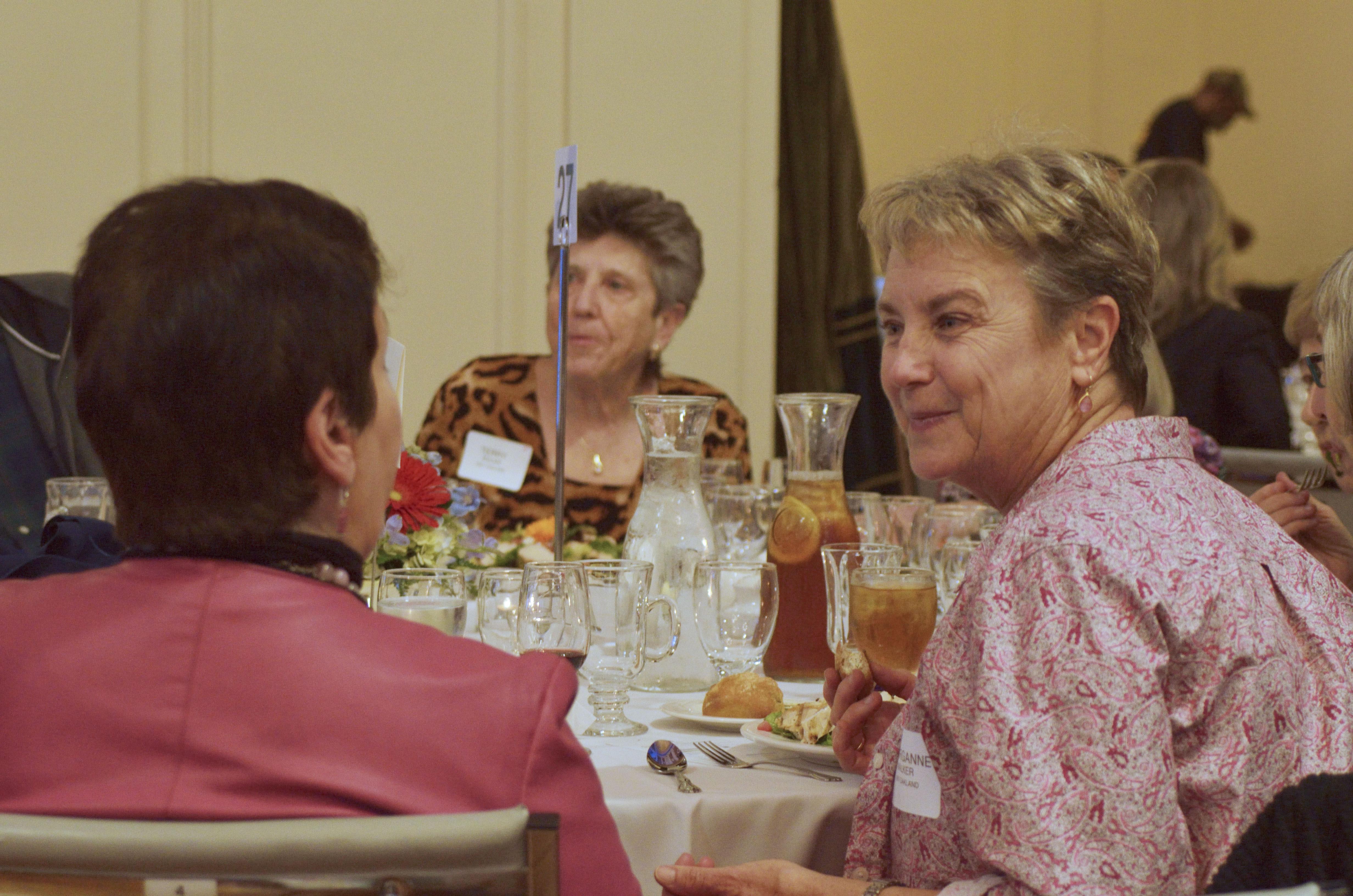 Luncheon Table Discussion Photo of people chatting at a table at the 2018 Luncheon