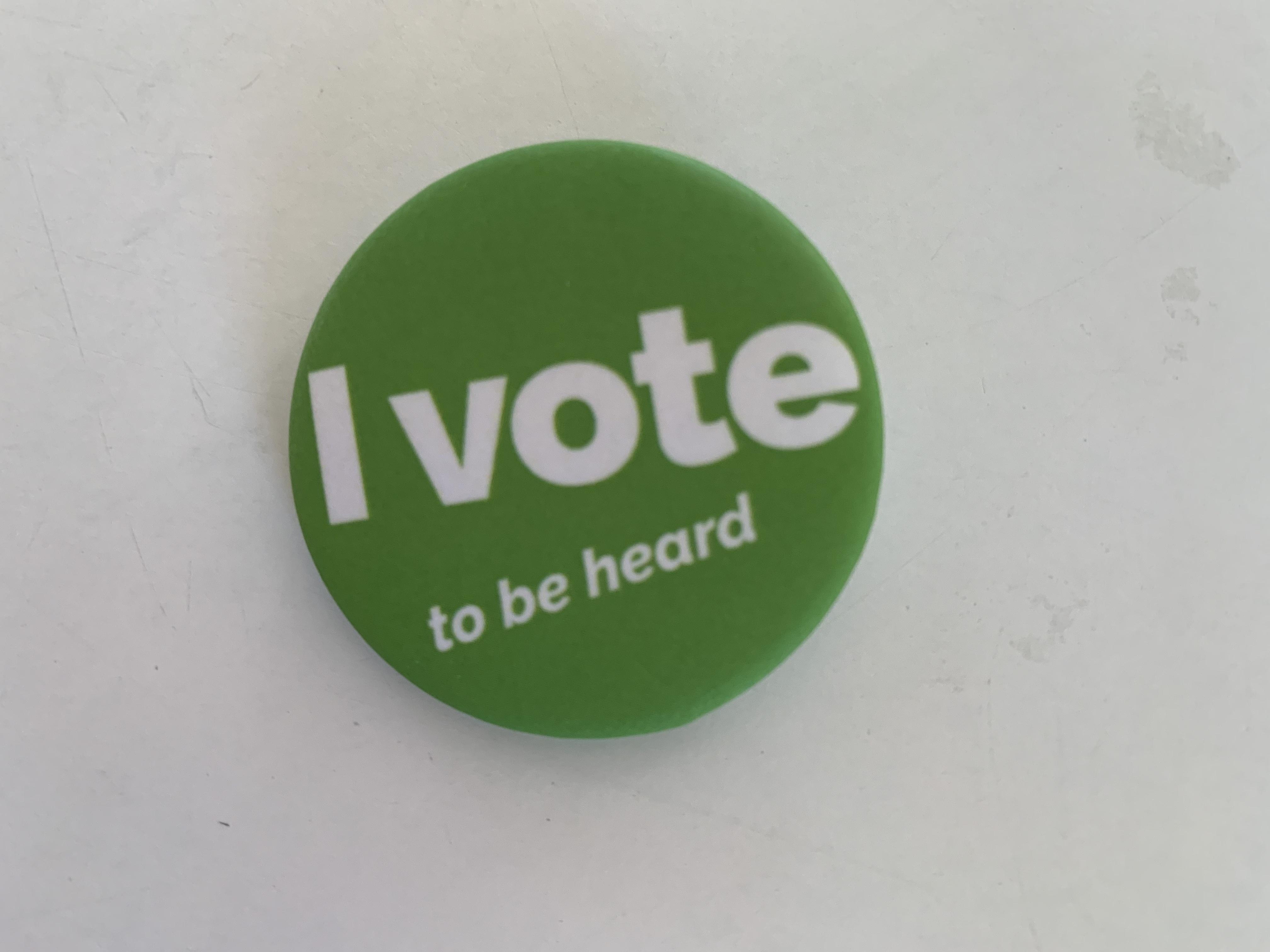 green button with the text "I vote to be heard"