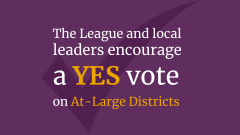 The League and local leaders encourage a YES vote on At-Large Districts in white and gold text on a purple background