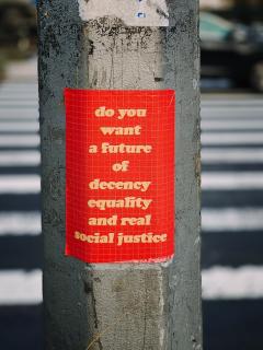 Poster on pole: do you want a future of decency equality and real social justice