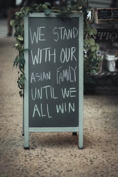 sign board Stand with our Asian Family