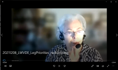 Linda Barnett shown speaking into headset on a Zoom video frame
