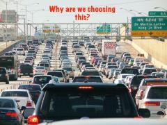 7-lane bumper-to-bumper traffic backup shown, text "Why are we choosing this?"