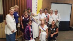 Group of women with manikin dressed as suffragist