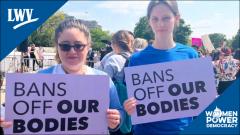 Women Holding Sign Bans Off Our Bodies