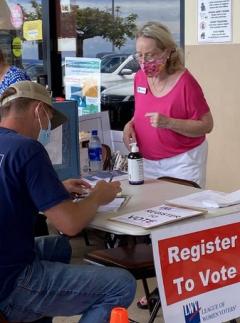 West Hawaii Today - LWV Volunteer registering voter