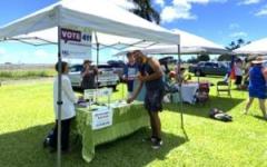 LWVHC volunteers staff a voter registration table at the 2024 Hilo Pride Festival