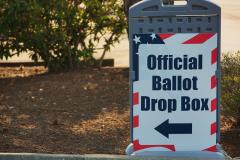 Sign Pointing to a Ballot Drop Box