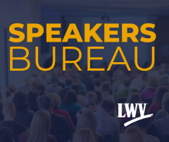 gold text on a dark blue overlay of image of a room full of people listening to a speaker