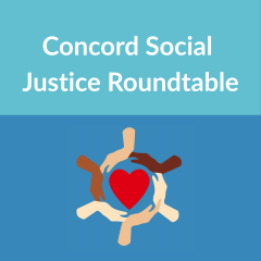 Hands in a circle with a red heart in the middle