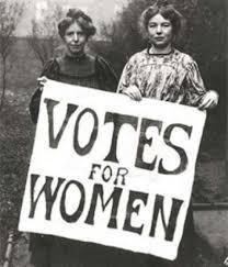 Two young women hold up sign "Votes for Women" (black & white photo)