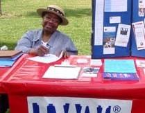 Woman manning an LWV voter registration table
