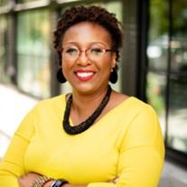 African American Woman with arms crossed, yellow top