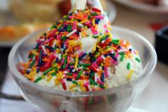 Ice cream in a cup with candy sprinkles