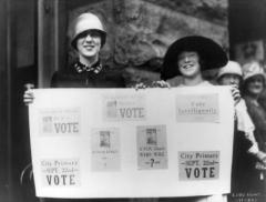 Suffragettes Holding Voting Banner