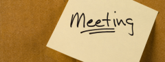 The word meeting is written on a yellow sticky note. 