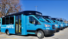 Several of Metro's Call-A-Ride vans lined up