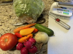 Fresh Produce must be cleaned thoroughly to avoid food-borne parasites Fresh Vegetables with cutting board, peeler, and scrub brush