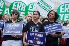 Group of Women holding signs demanding Equal Rights 