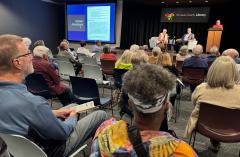 60 people in audience watch panel discussion on Amendment 7 
