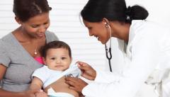 Mother and child with female doctor