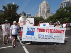 charlotte leaguers carrying vote411 sign
