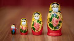Photo by Evgeni Tcherkasski on Unsplash Photo of Russian Nesting Dolls with Masks