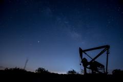 Texas oil field in night sky