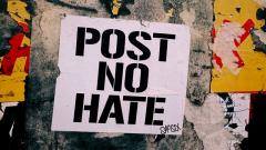 Photo by Jon Tyson on Unsplash Wall with grafitti " Post No Hate "