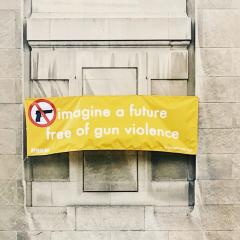 Sign "Imagine a future free of gun violence" on building
