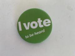 green button with the text "I vote to be heard"