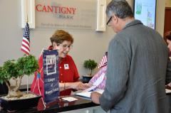 Barb Laimins registers voters at the Naturalization Ceremony.