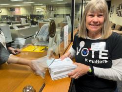 Betsy delivering voter reg forms to Elections Office