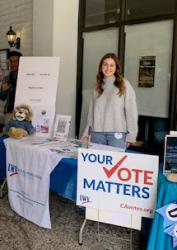 Voter Registration table with volunteer