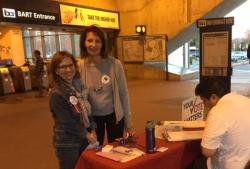 Tiffany and Barbara assist a voter to register at Walnut Creek BART