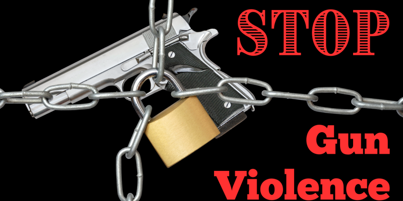 Stop Gun Violence red text on black background with gun covered in chain and lock