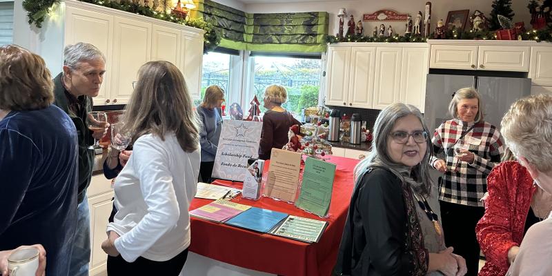 LWVBF members around a table at the 12/8 holiday party