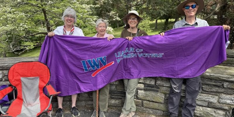 LWVCDC members display banner at Stand Tall for Workers rally
